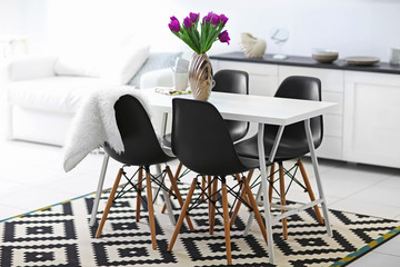 Beautiful comfortable modern interior with table and chairs