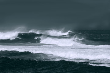 Stormy seas in the Pacific Ocean, rendered in monochrome.