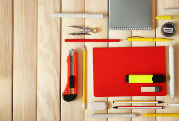 Flat lay of stationery on wooden background