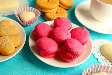 Valentine concept. Composition of cookies and candies on blue background