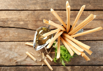 Bread sticks with arugula and oil, closeup