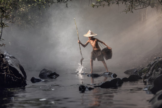 Boy fishing in creeks