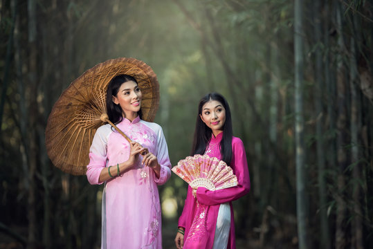 Portrait of Vietnamese girl traditional dress, Ao dai is famous traditional costume for woman in Vietnam