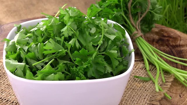 Portion of fresh cutted rotating Parsley as not loopable 4K UHD footage