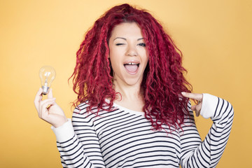 Happy woman having a brilliant idea.