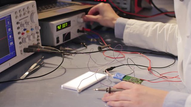 Woman In The Electronics Lab