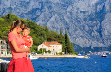 Fototapeta na wymiar mother and little daughter looking at Perast, Montenegro