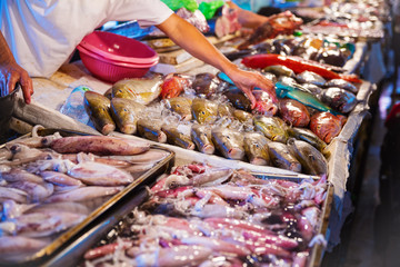 Different kinds of seafood at fish market - Powered by Adobe