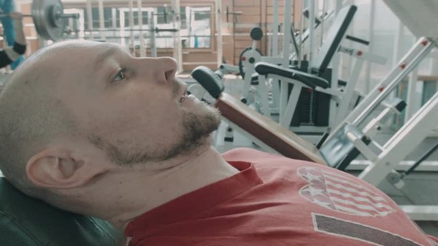 Athlete runner or sprinter does workout for legs on on leg press machine. Preparate for olympic competition. Movement shot