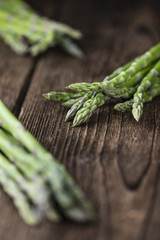 Green Asparagus (close-up shot) on wood