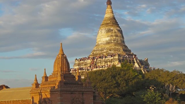 Tourists are greeted sunset at the Shwesandaw Pagoda (Paya) in Bagan, Myanmar (Burma), zoom in
