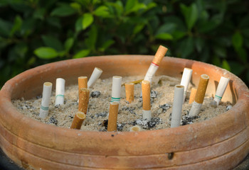 Discarded cigarette into the ashtray, quitting smoking conceptua