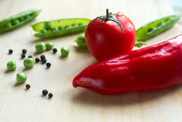 Tomato and pepper with dill on the table