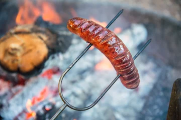 Küchenrückwand glas motiv Preparing sausage on campfire  © Mariusz Blach