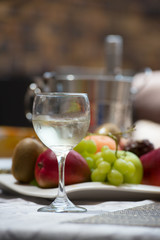 Ice bucket, bottle and glass of white wine 