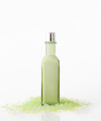 Studio shoot of blank green bottle on white