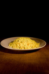 Risotto with Saffron on wooden table