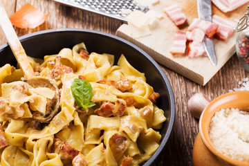 Pasta Carbonara with bacon, basil and cheese