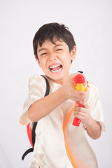 Little boy playing water on water festival Thailand new year