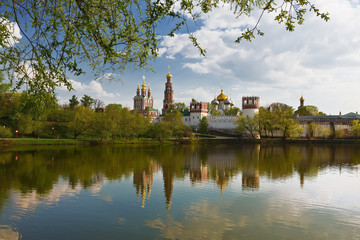 Novodevichy convent with the reflection in the lake at sunset