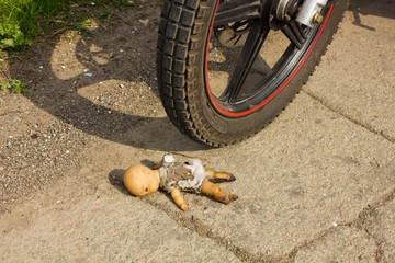 Burned old kewpie doll