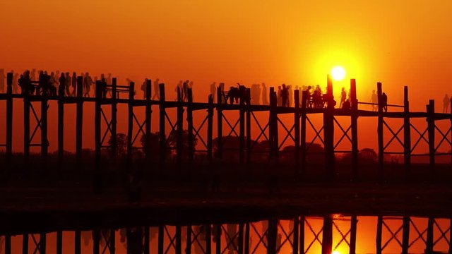 Famous U-Bein teak bridge at sunset on Taungthaman lake, Mandalay, Myanmar, timelapse 4k
