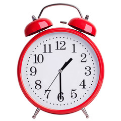 Round alarm clock shows half of the second