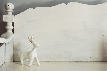 Wooden deer toy on bench