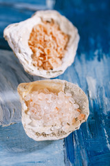 sea salt in sea shell oyster on blue
