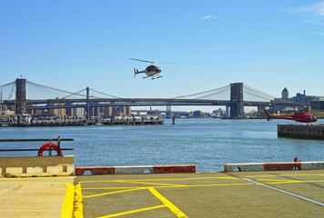 Helicopters near Brooklyn bridge and Manhattan bridge and East River