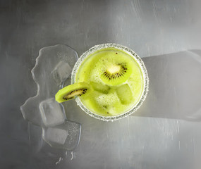 Smoothies of kiwi on a metal background. Top view