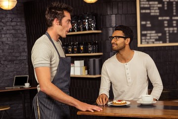 Waiter and customer talking