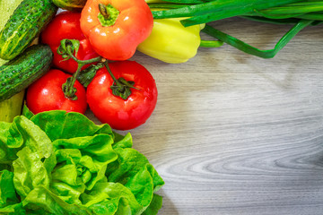 Fresh vegetables on grey wood
