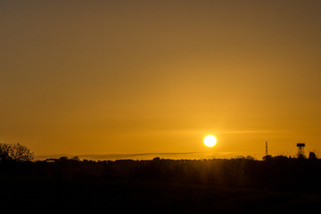 Fototapeta premium Sunrise over a water tower