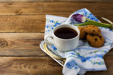 Cup of tea and cookies on tea tray