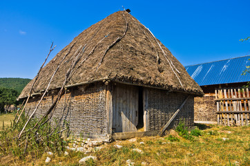 Fototapeta na wymiar Rural wooden lodge at Pešter plateau landscape in southwest Serbia