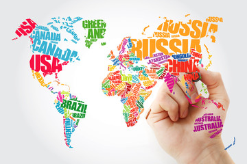 Hand showing World Map in Typography word cloud concept, names of countries