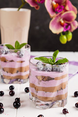 Black currant and chocolate dessert in glass