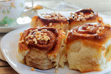 Sweet buns with cinnamon, nuts and caramel syrup