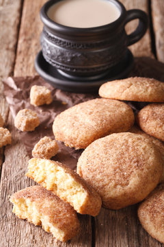 cookies Snickerdoodle and coffee with milk close-up on the table. Vertical
