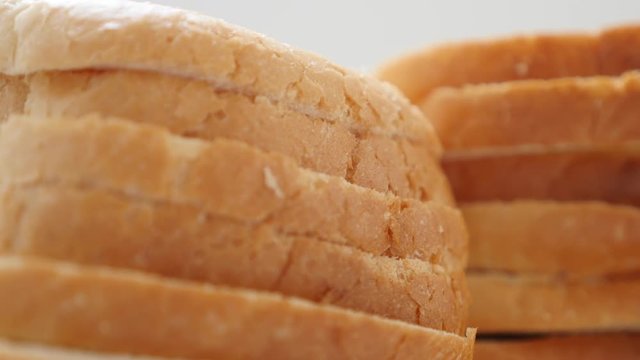 Toasting bread pieces bunch food background slow tilt 4K 2160p 30fps UltraHD video - Slow tilting on fresh pile of bread for toaster 4K 3840X2160 UHD footage 