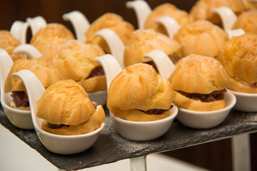 Eclair on ceramic spoon