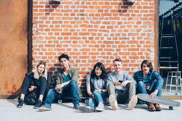 Group of young beautiful multiethnic friends sitting on the floo © Eugenio Marongiu