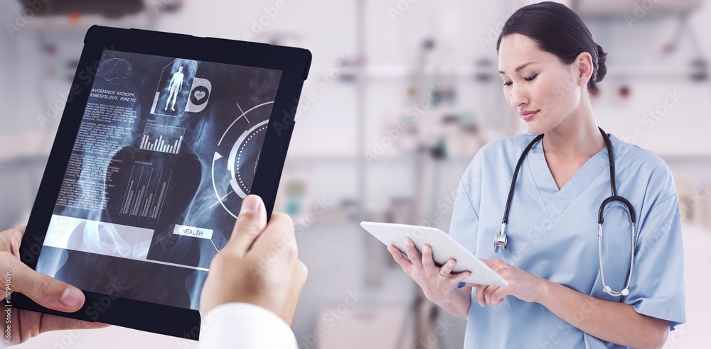 Poster composite image of surgeon using digital tablet with group