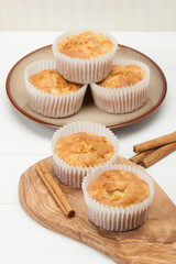 Homemade Apple Cinnamon Muffins On Olive Board.