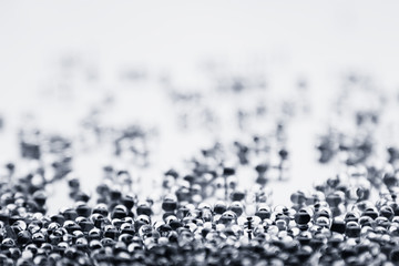 Minimalist abstract light background with transparent glass particles. The texture.