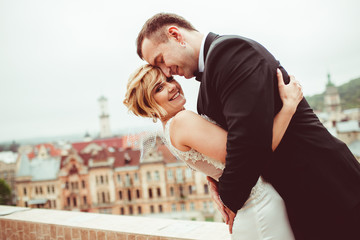 wonderful  married couple hugging on the street