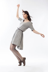 Obraz premium beautiful girl in motion on white backround