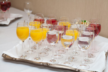 Red and yellow juice in tall glasses