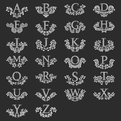 Set of all letters heraldic monograms in coats of arms form. Vintage latin alphabet with floral wreaths. Isolated tattoo labels in vintage baroque style.